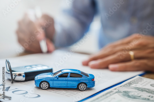 Cuadros en Lienzo Sale agent deal to agreement successful car loan contract with customer and sign agreement contract Insurance car concept