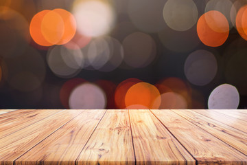 Wall Mural - Wood Table Top Counter on night city lights bokeh background,lights blurred bokeh blurred background for montage product