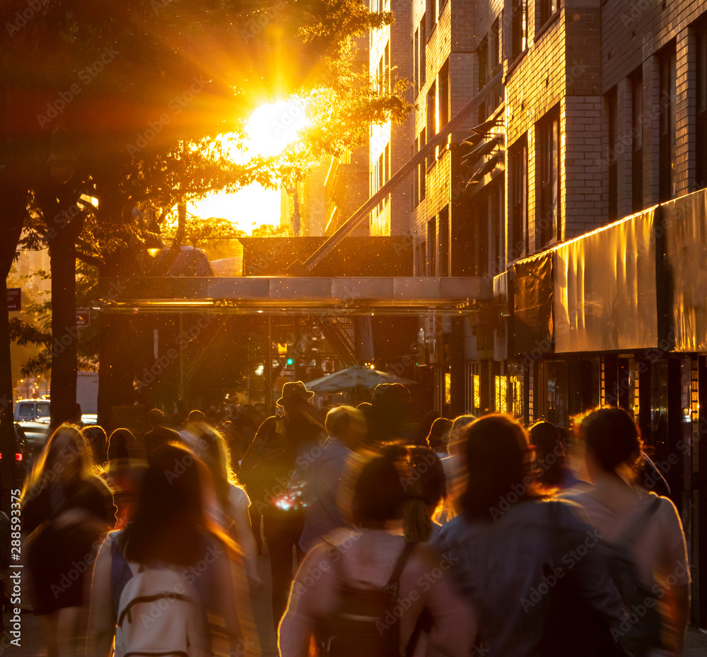 Busy crowds of people in motion walking down 14th Street in Manhattan ...