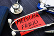 © Vitalii Vodolazskyi - Medicare fraud sign and stethoscope with papers.