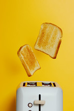 Slices Of Toast Jumping Out Of The Toaster