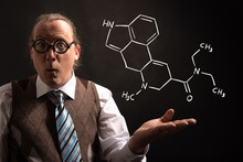 Professor Presenting Handdrawn Chemical Formula Of LSD