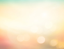 Summer Holiday Concept: Abstract Bokeh Flare Sunlight With Blur Green And Yellow Nature Sunrise Beach Background