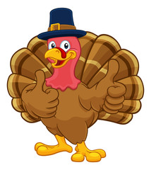 Pilgrim Turkey Thanksgiving bird animal cartoon character wearing a pilgrims hat and giving a thumbs up