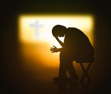 Hope Concept: Christian Praying For Waiting Holy Spirit Over Blurred Cross Of Jesus Christ In Dark Room Background