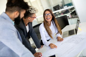 Group of coworkers working together on business project in modern office