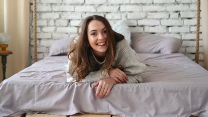 Wall Mural - Playful young woman have fun in bed at home