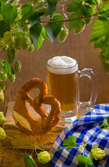 Bavarian Oktoberfest beer and pretzels on wooden table