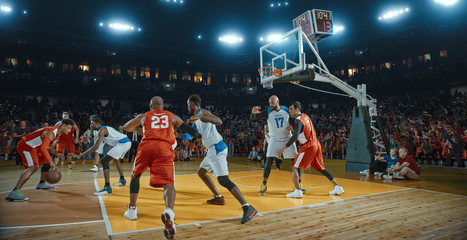 basketball players on big professional arena during the game. tense moment of the game. celebration