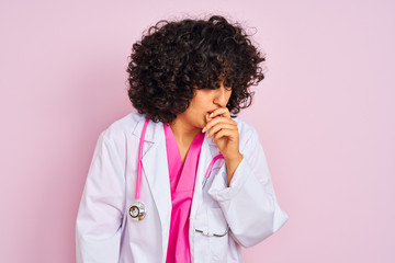 Sticker - Young arab doctor woman with curly hair wearing stethoscope over isolated pink background feeling unwell and coughing as symptom for cold or bronchitis. Healthcare concept.