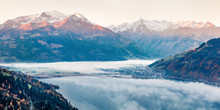 Picturesque View Of Zell Lake In The Morning Mist With Grossglockner Peak On Background. Foggy Autumn Sunrise In Austria, Europe, Zell Am See Town. Instagram Filter Toned. Orton Effect.