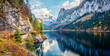Colorful autumn panorama of Vorderer ( Gosausee ) lake with Dachstein glacier on background. Splendid morning view of Austrian Alps, Upper Austria, Europe. Orton Effect.