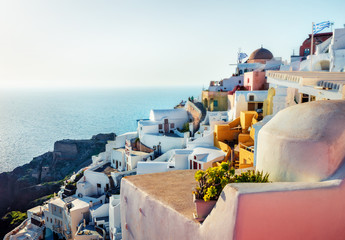 Wall Mural - Sunny morning view of Santorini island. Bright spring scene of the famous Greek resort Oia, Greece, Europe. Traveling concept background. Artistic style post processed photo.