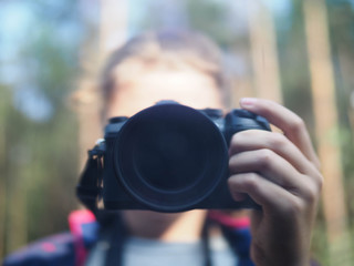 shot of a girl holding a camera.