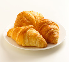 3 Butter Croissants On White Plate On White Background
