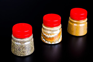 Canvas Print - Jars with ground dried spices, herb. Photo