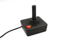 A Studio Shot Of A Atari Controller Isolated On A White Background.