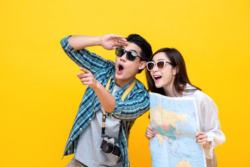 Excited young Asian couple tourist