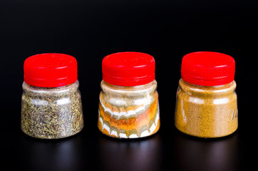 Canvas Print - Jars with ground dried spices, herb. Photo