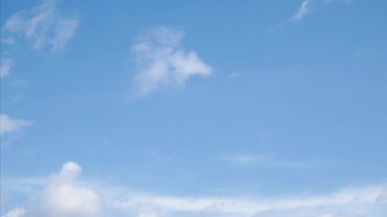 Wall Mural - time lapse white clouds on a blue sky. 4k fluffy white clouds moving during the day time.