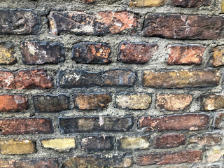 Poster - Antique red tempered brick wall. Part of the wall of an ancient building