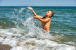 © fisher05 - Happy boy playing with water in the sea . Active child at the seaside resort . Children's outdoor recreation