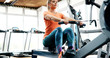 Workout woman cross training exercising cardio using rowing machine