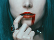 © Alex Photo - Beautiful vampire woman with red lips in blood.