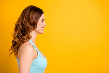 Poster - Copyspace photo of charming cute cheerful nice gorgeous fascinating girlfriend looking at something pleasing wearing turquoise tank-top isolated with yellow bright color background