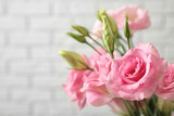 Eustoma flowers on light background, closeup. Space for text