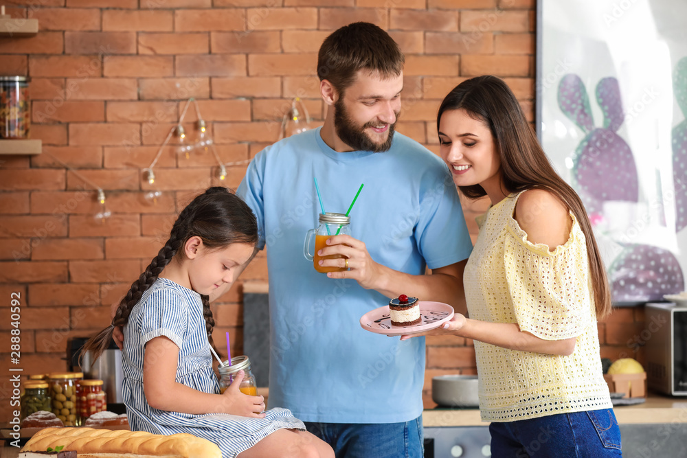 Young family together in kitchen