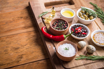 Wall Mural - Fresh salad ingredients (salt, pepper, olive, tomato, rosemary, oil )