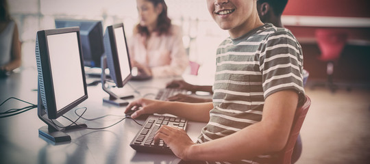 Student using computer in classroom