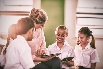 Poster - Teacher teaching kids on digital tablet