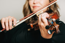 Studio Close Up Portrait Of Beautiful Woman With Violin, White Background
