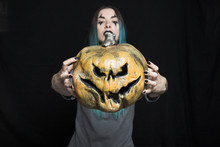 Young Woman With Jack-O-Lantern