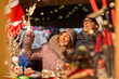 © Syda Productions - shopping, winter holidays and people concept - happy senior couple at christmas market souvenir shop on town hall square in tallinn, estonia