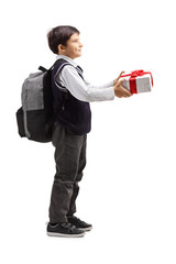 Poster - Schoolboy with a backpack giving a present