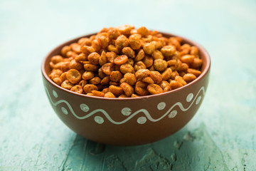 Poster - Fried and Spicy Chana Dal Masala is a popular Chakna recipe. served in a bowl. selective focus