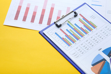 Poster - Financial papers with graph and charts on yellow background