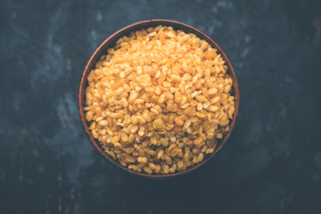 Poster - Salty and Fried Moong Dal Namkeen served in a bowl, selective focus