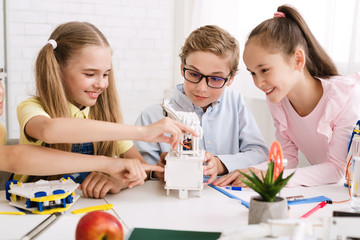 Poster - School pupils creating modern robots at stem class
