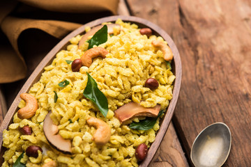 Jada Poha Namkeen Chivda / Thick Pohe Chiwda is a jar snack with a mix of sweet, salty and nuts flavours, served with tea. selective focus