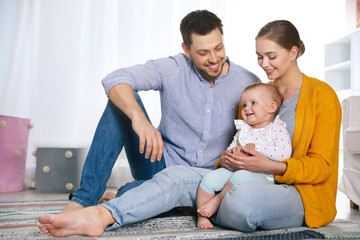 Wall Mural - Parents spending time with their baby at home