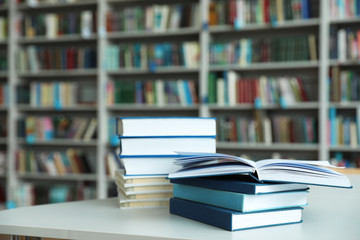 Wall Mural - Stack of books on white table in library