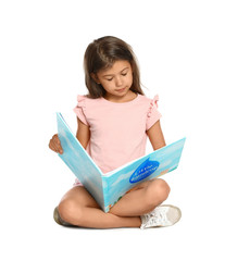 Wall Mural - Cute little girl reading book on white background