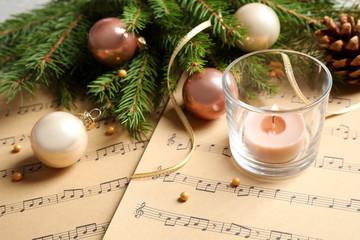 Sticker - Composition with Christmas decorations on music sheets, closeup