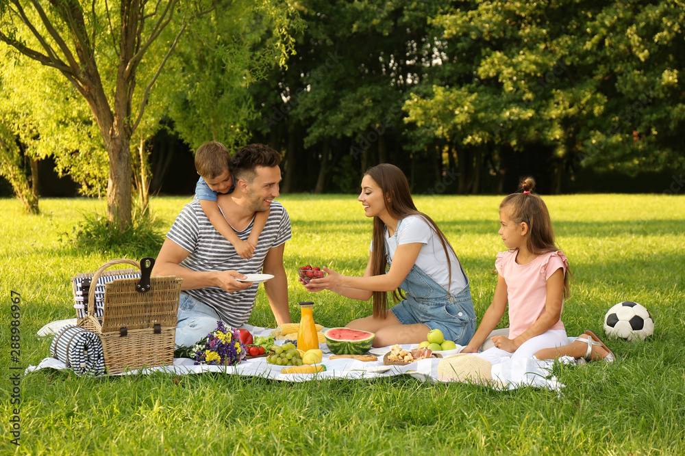 Happy family having picnic in park on sunny summer day Stock Photo ...