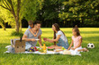 © New Africa - Happy family having picnic in park on sunny summer day