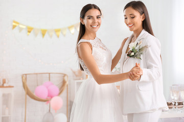 Canvas Print - Beautiful lesbian couple during wedding ceremony